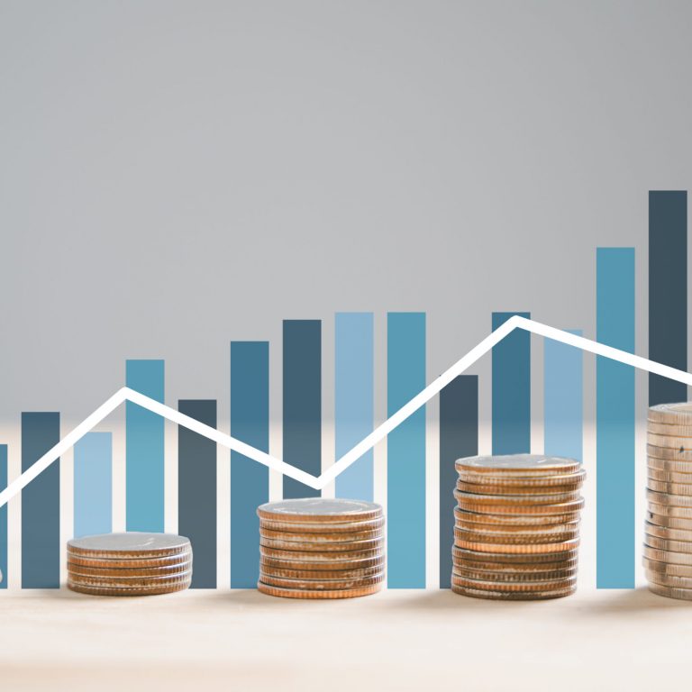 Stack of silver coins aligns with an ascending trading chart arrow, epitomizing financial concepts and investment in business stock growth. Technology leaps further this narrative. money saving graph
